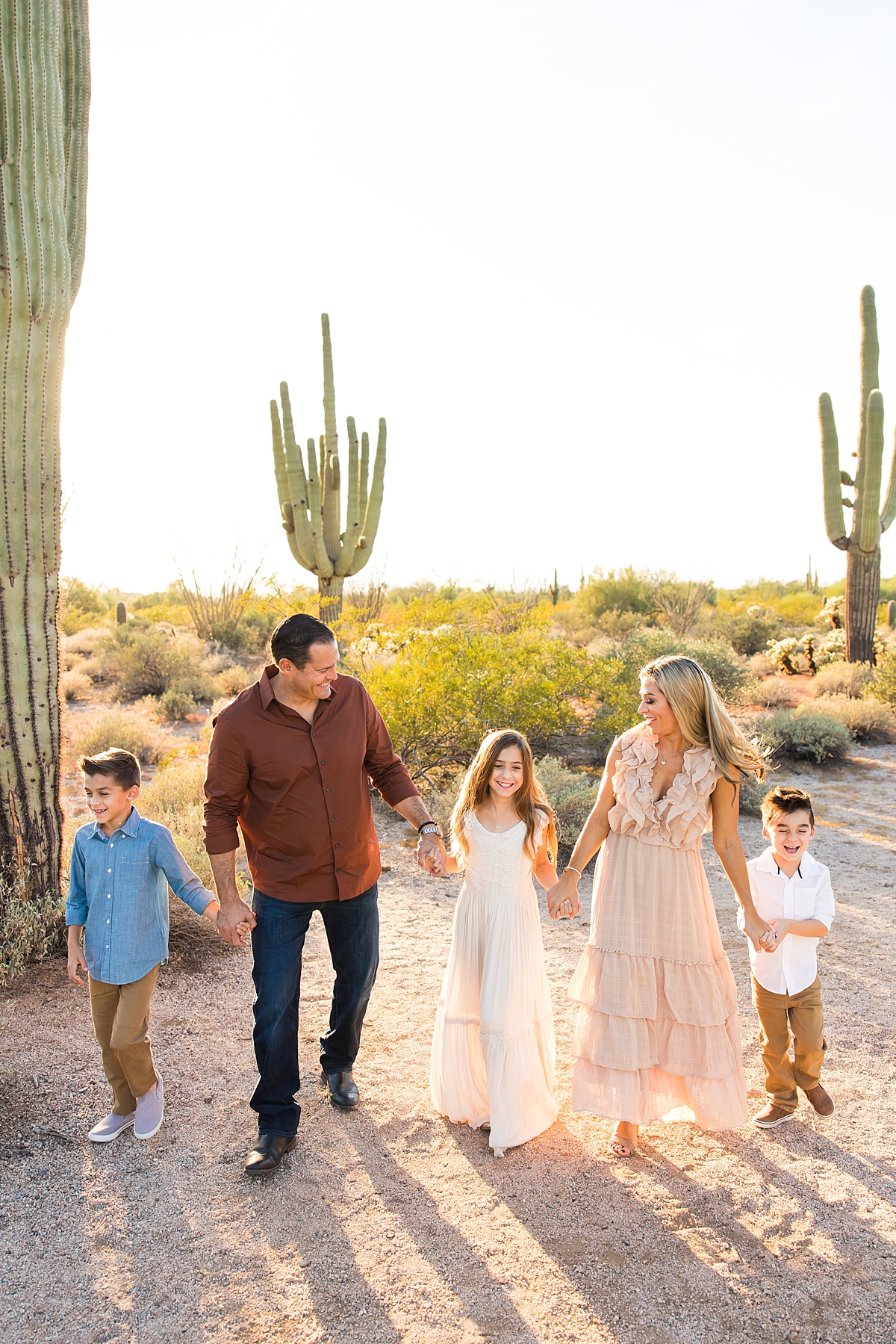 Leah Hope Photography | Scottsdale Arizona Family Photographer | Phoenix Arizona Family Pictures | Desert Landscape Cactus Mountains Scenery | Sunset Natural Light | What to Wear | How to Pose | Family Poses | Styling Outfits for Pictures | Family Photos | Family Posing Ideas | Family Color Scheme Palette | Coordinating Outfits | Golden Hour Sunlight | Family Photo Shoot Outfit Inspiration