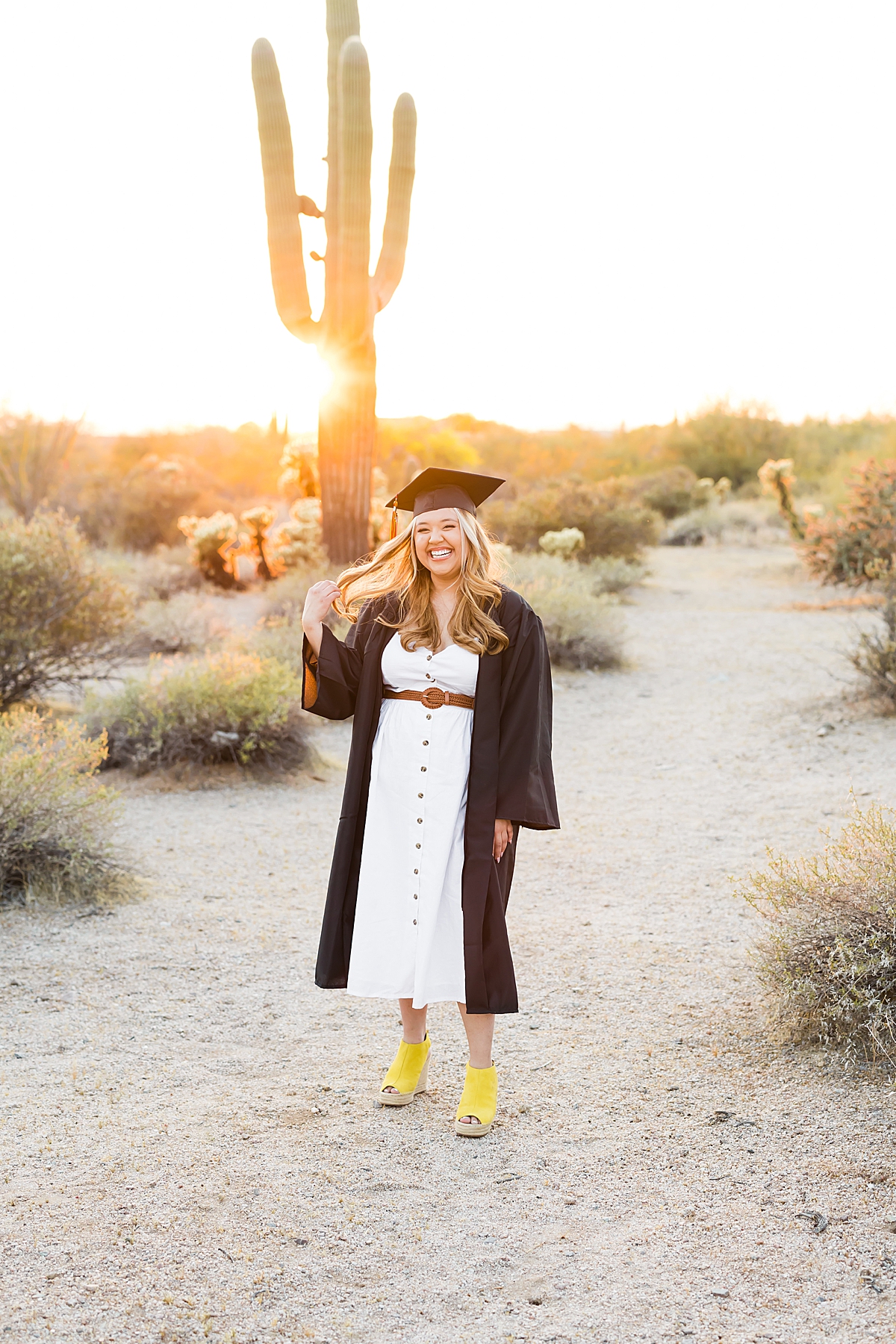 Leah Hope Photography | Scottsdale Arizona Senior Photographer | Phoenix Arizona High School Senior Pictures | Natural Light Photography | What to Wear | Senior Girl Poses and Posing Ideas | Senior Photo Shoot Outfit Inspiration | Outfits and Styling Fashion Ideas | Cactus Desert Scenery | Golden Hour Sunset Light | Cap and Gown | Graduation Pictures
